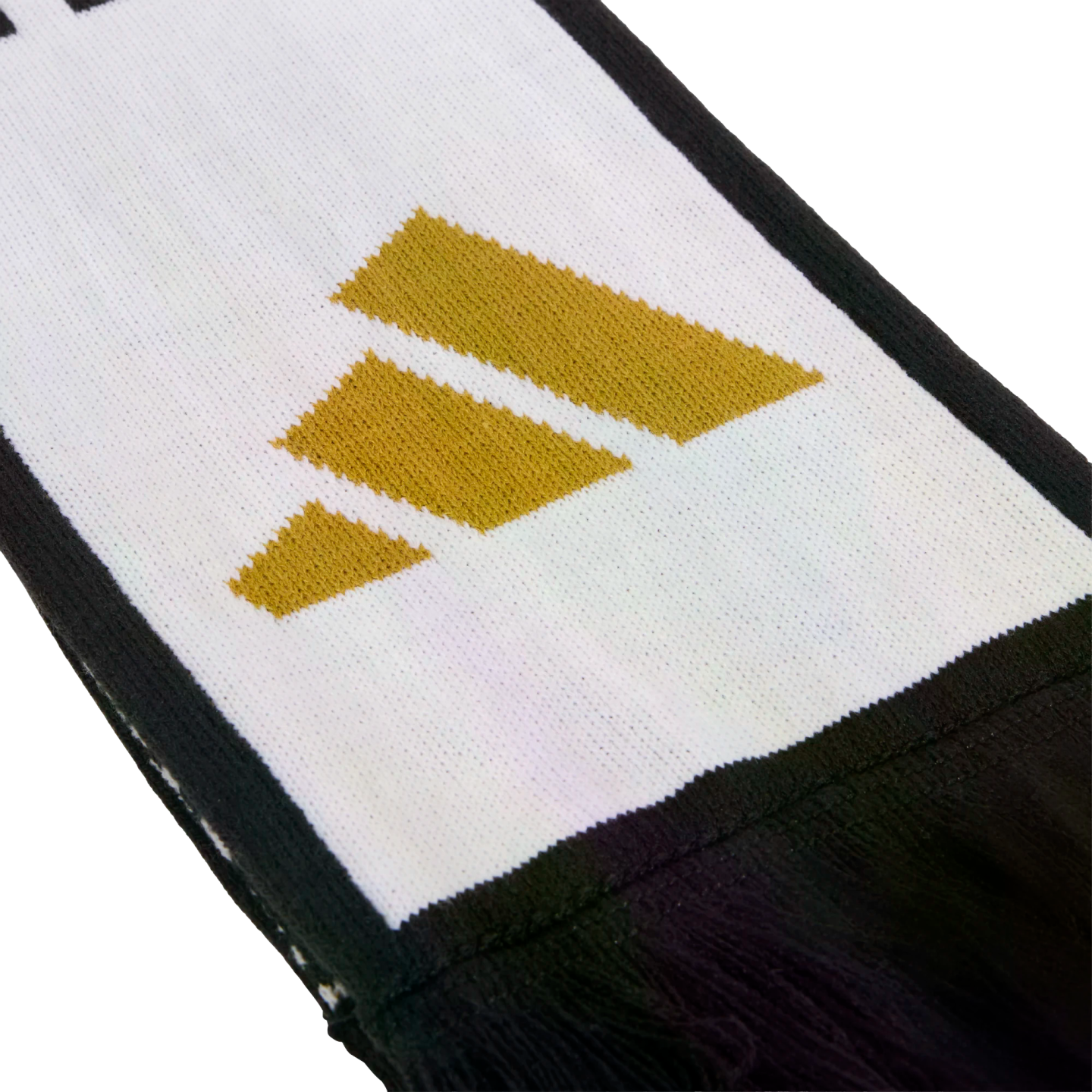 Close-up of a white knitted scarf with a black border, featuring a gold three-stripe logo and black fringes at the end.