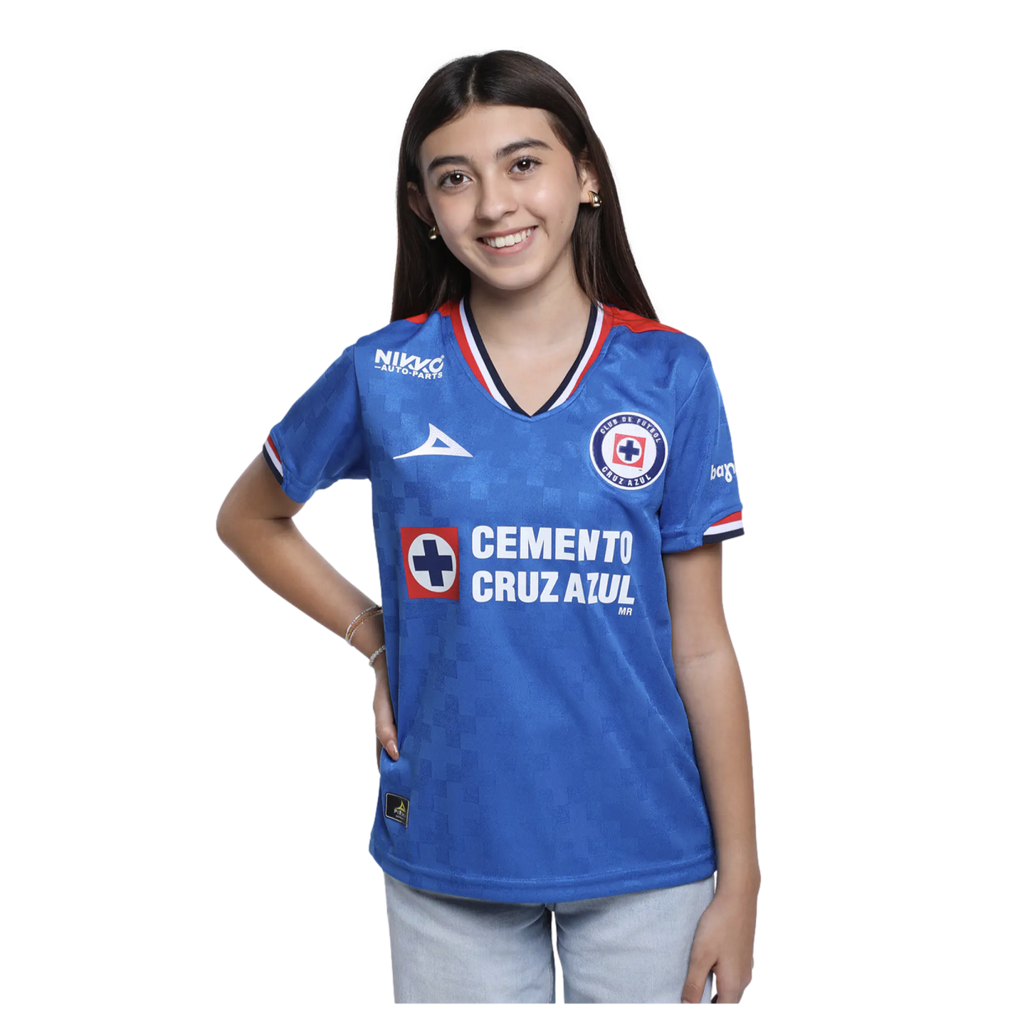 A smiling young woman with long dark hair wearing a blue Cruz Azul soccer jersey and light-colored jeans, standing against a solid black background.