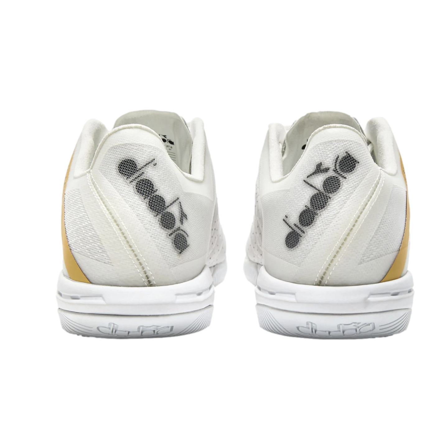Rear view of a pair of white Diadora tennis shoes with gold side accents against a black background. The brand logo is featured on the mesh heels and white midsoles.