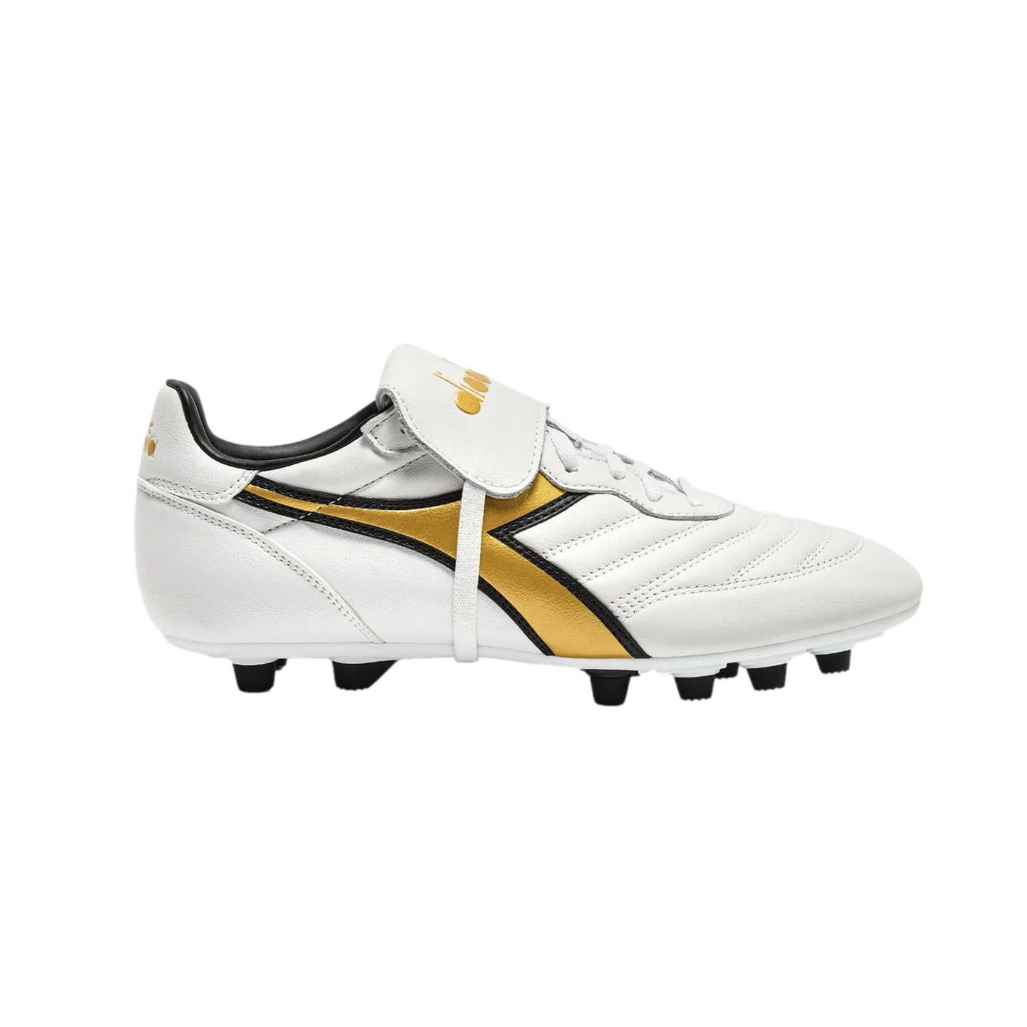 Side profile of a white Diadora soccer cleat with gold and black accents, a fold-over tongue, and black studs on a black background.