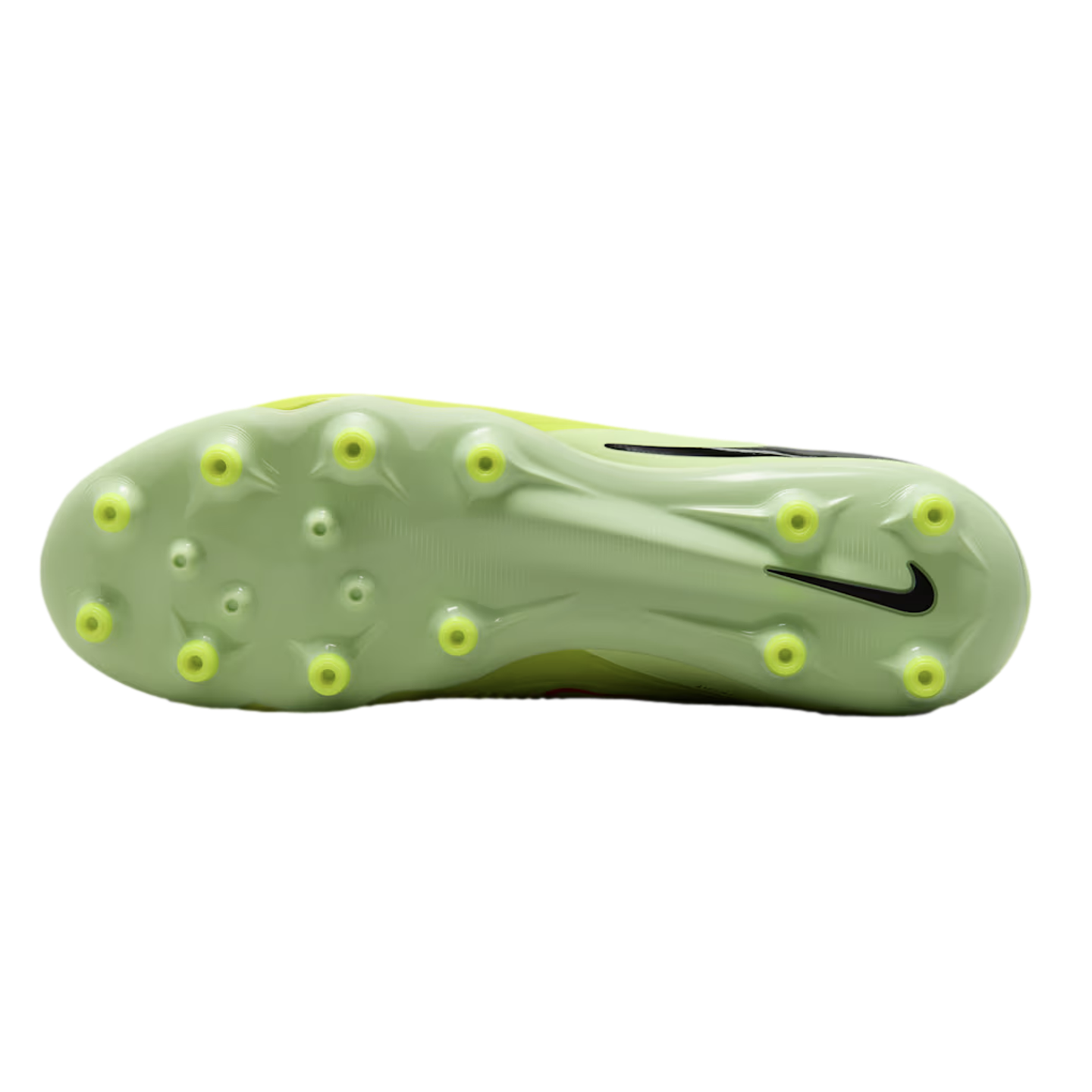 The light green soleplate of a Nike soccer cleat with yellow conical studs, shown against a black background.