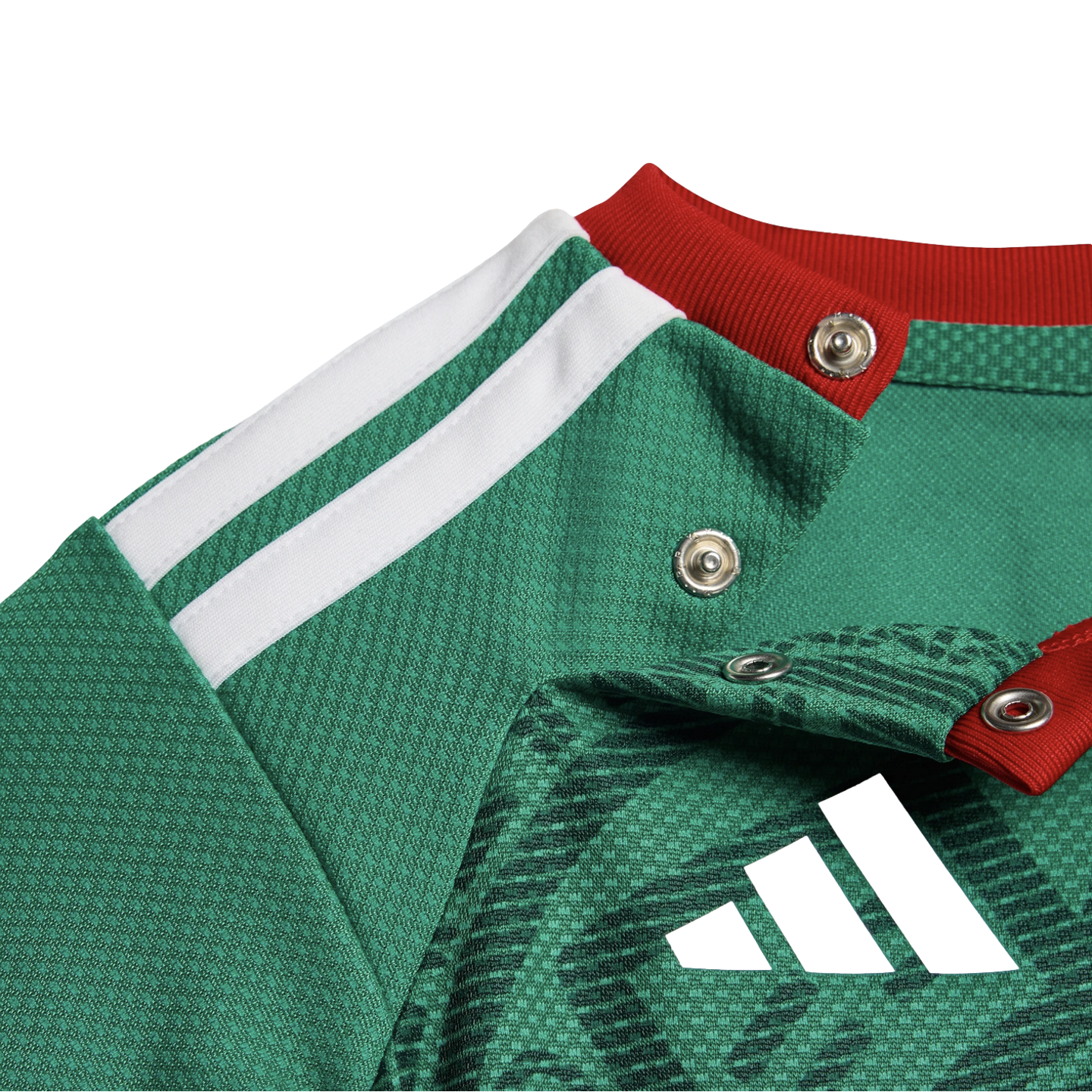 Close-up of a green Adidas jersey featuring white shoulder stripes, a red ribbed collar with snap buttons, and a black logo on textured, patterned fabric.