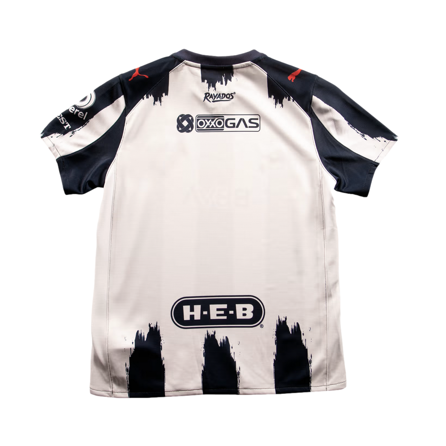 Back of a white and navy blue Puma Rayados soccer jersey featuring brush-stroke stripes and sponsor logos for OXXO GAS and H-E-B.