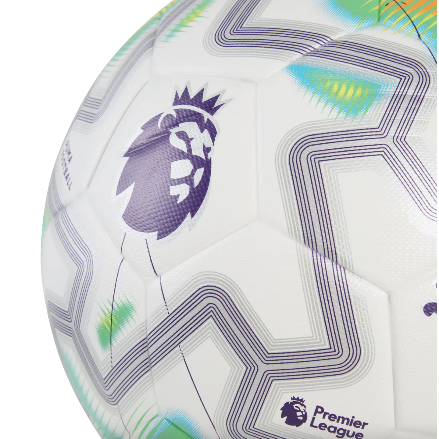 Close-up of a white Premier League soccer ball featuring the purple lion logo, geometric zig-zag patterns, and vibrant green and blue accents on its textured surface.