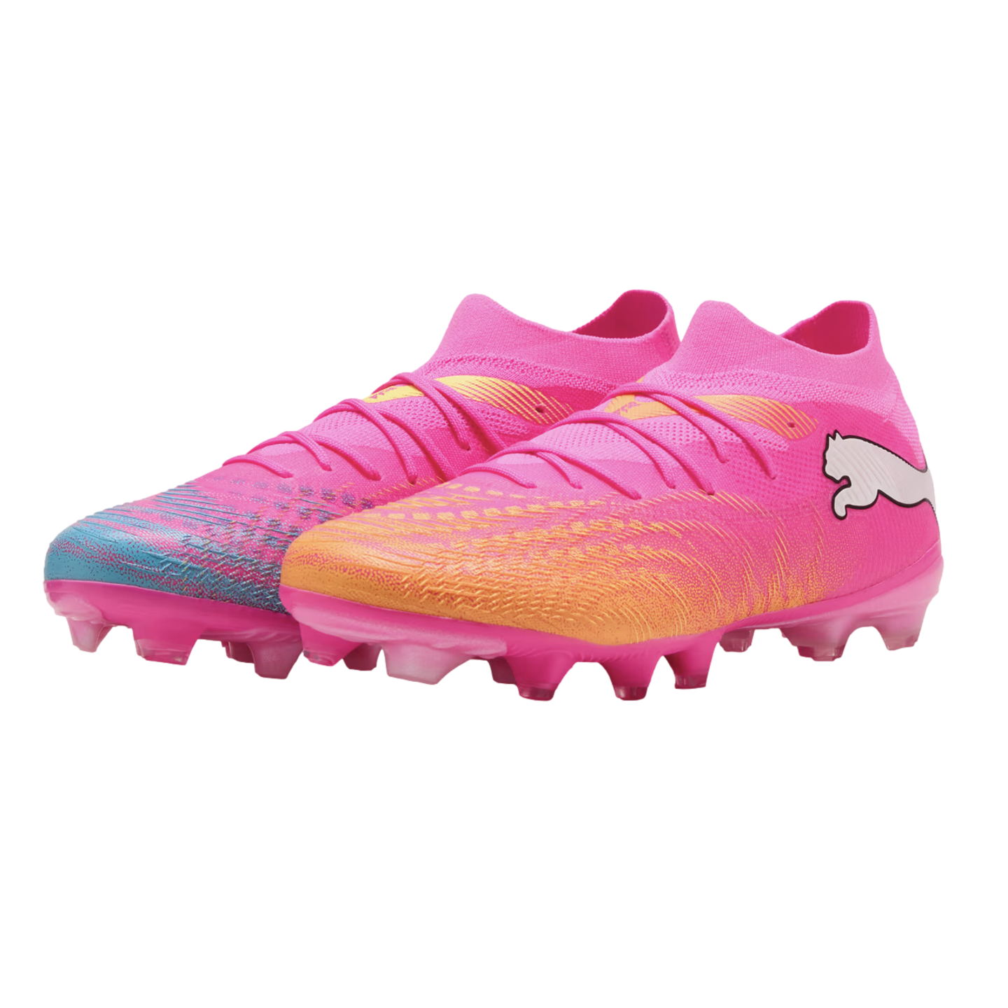 A pair of pink Puma soccer cleats with a sock-like fit. One boot features a teal-patterned toe, and the other an orange-patterned toe.