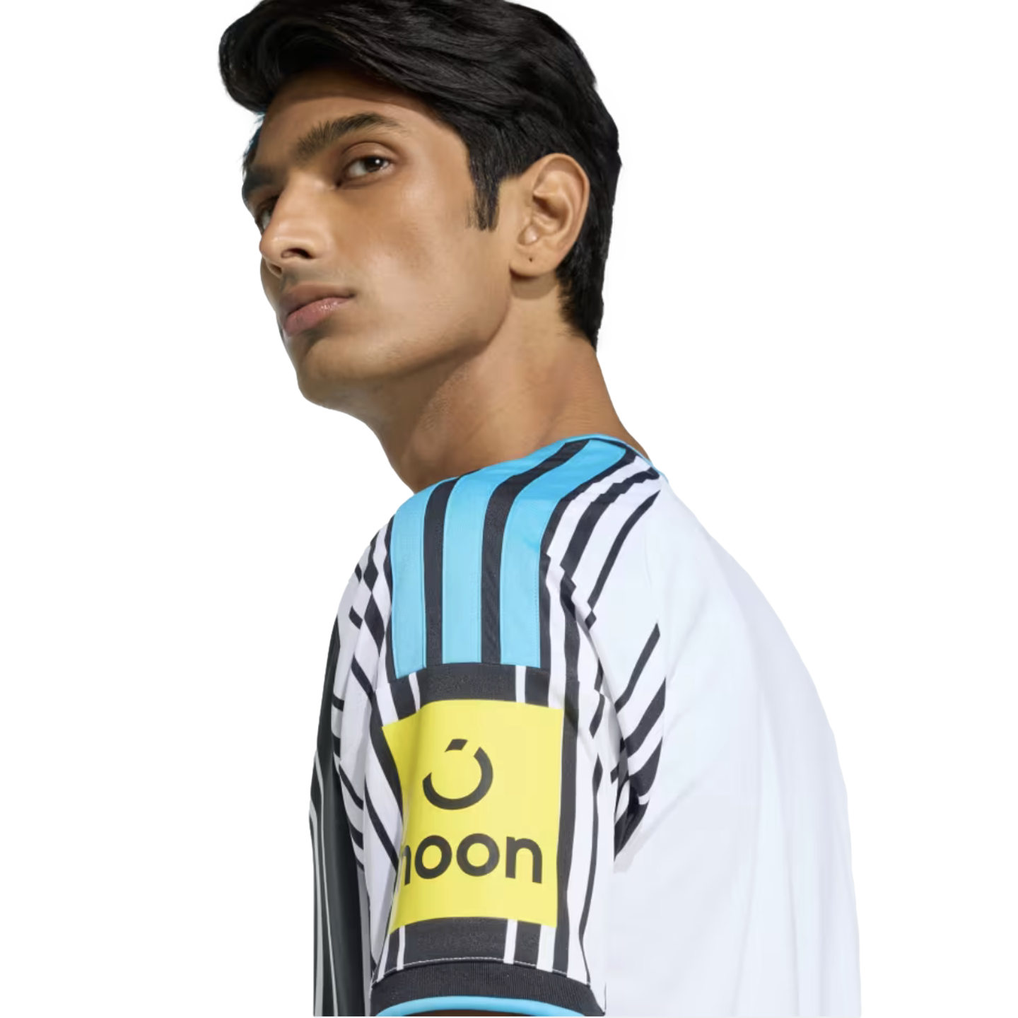 Side profile of a man wearing a white and black striped jersey with a light blue shoulder panel and a yellow 'noon' logo patch on the sleeve.